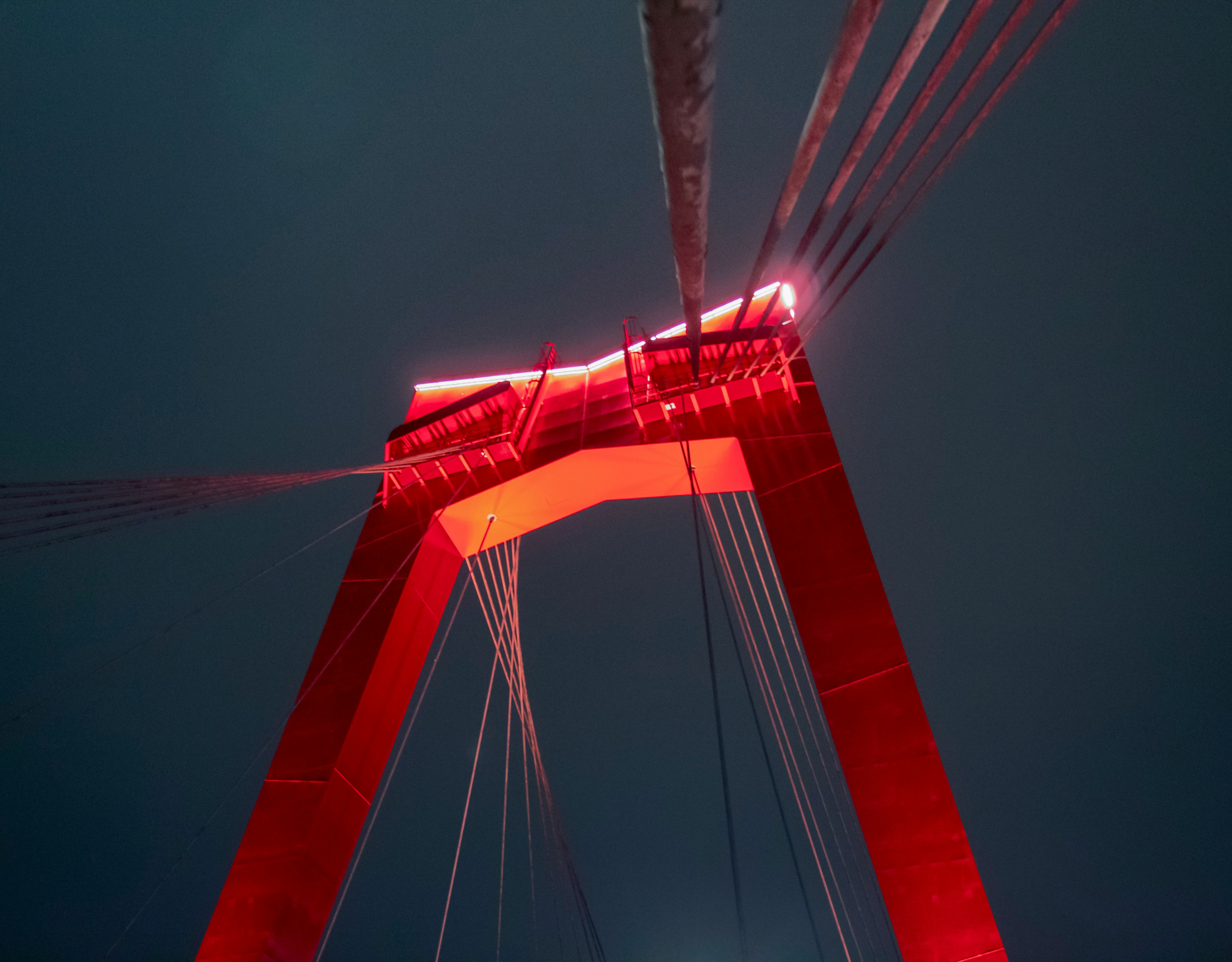 red cable-stayed bridge during night time